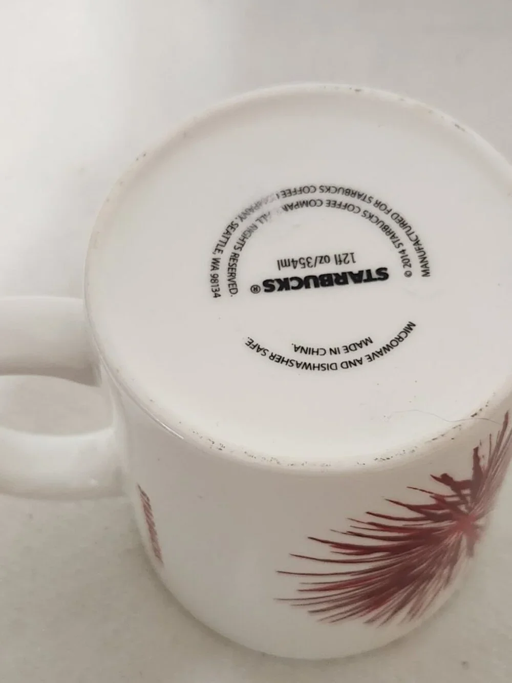 Starbucks 2014 Christmas Holiday Red Starburst White Ceramic Coffee Mug 12 OZ
